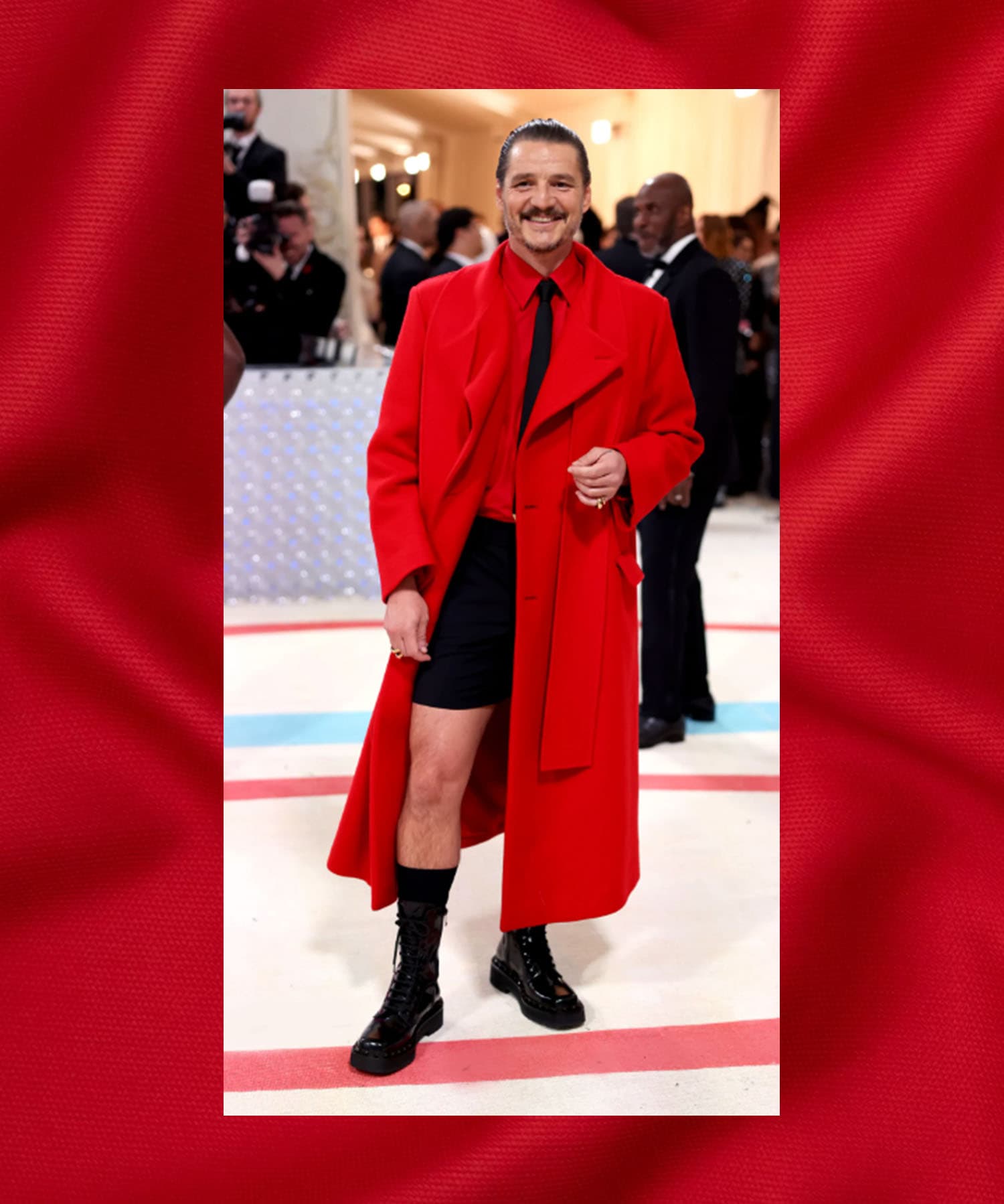 Pedro Pascal in a red coat