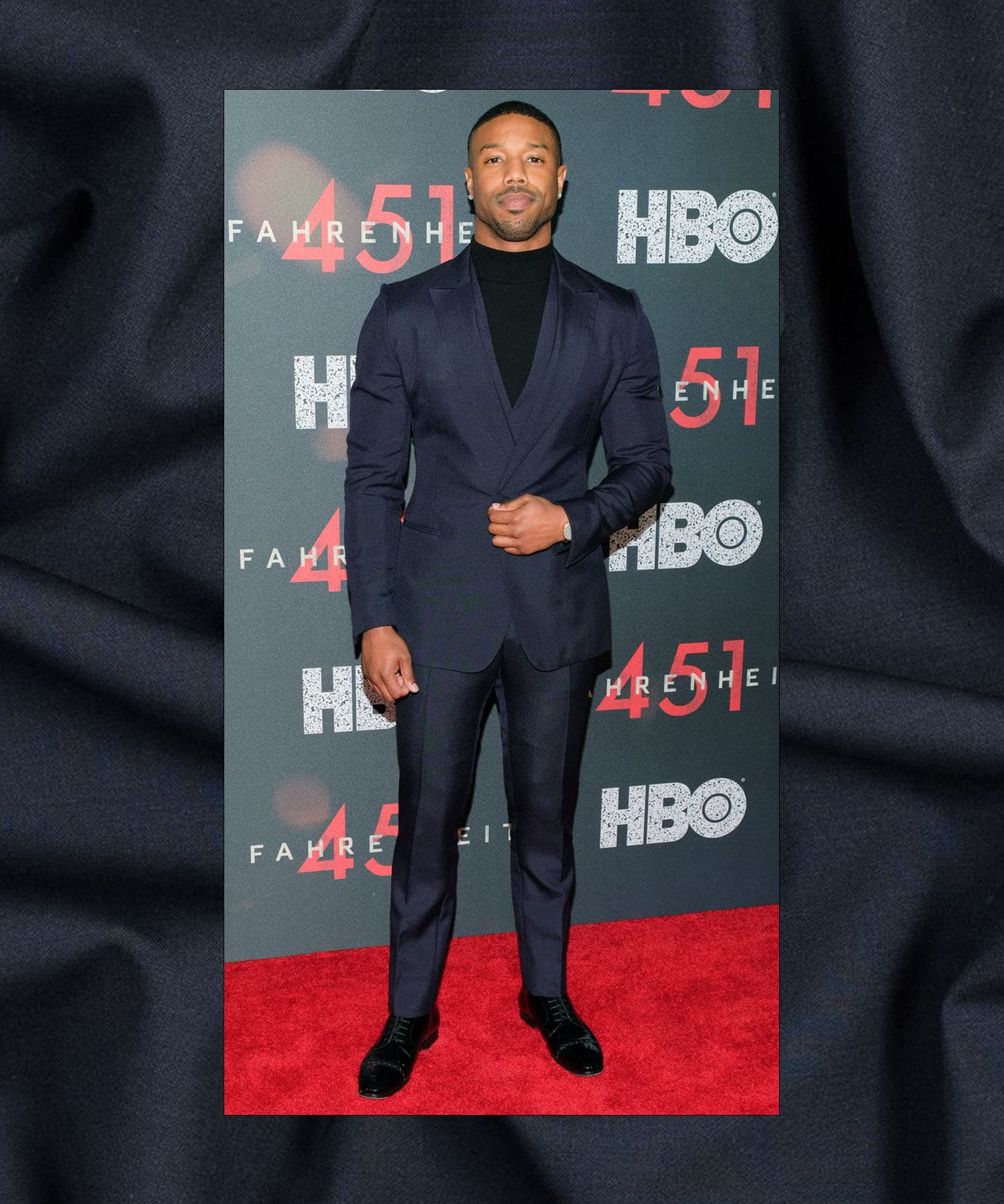 Michael B Jordan in a navy wool suit