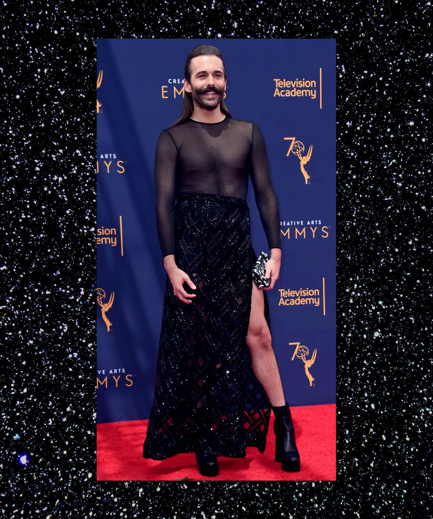 Jonathan Van Ness in an shimmery fabric dress